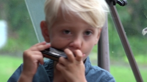 Joseph on Harmonica at Student party 2022
