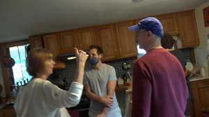 People mingling in kitchen at Student party 2022