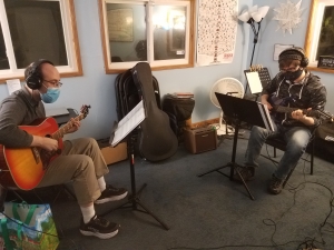 Stephen and Alex. student playing
