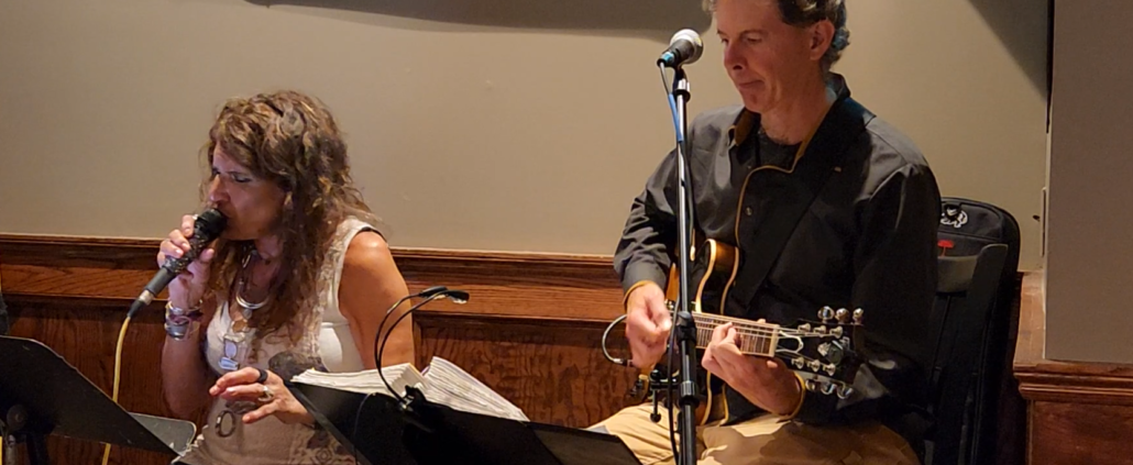 Dennis accompanying a singer