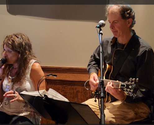 Dennis accompanying a singer