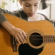Young guitarist concentrating