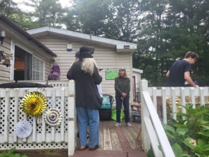Porch with students and family at Student party 2023
