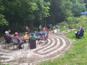 Fire pit with party attendees at Student party 2023
