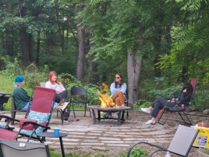 Chatting around the fire pit at Student party 2023