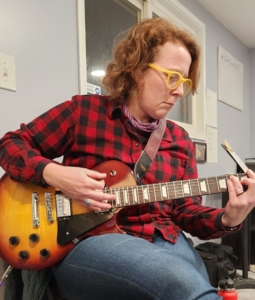 adult with guitar teacher ithaca