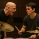 a depiction of a scene in the movie Whiplash with teacher yelling at student